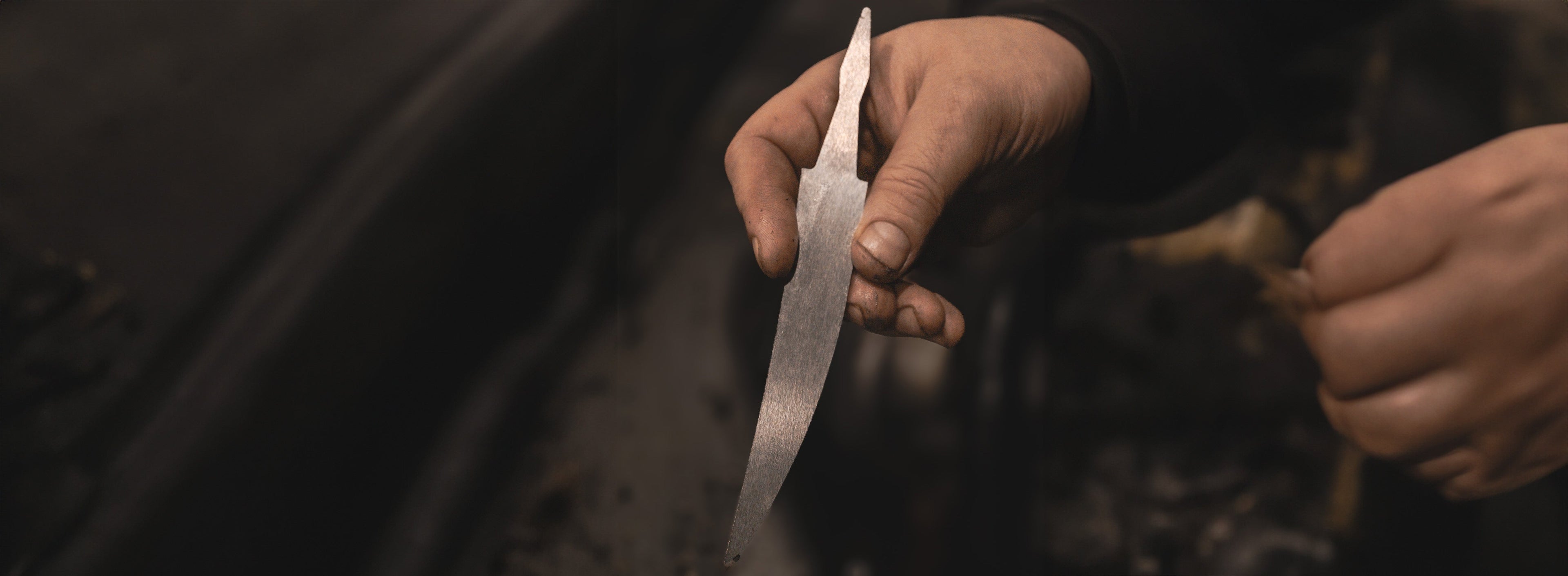 Roselli handmade knife blade being sharpened 